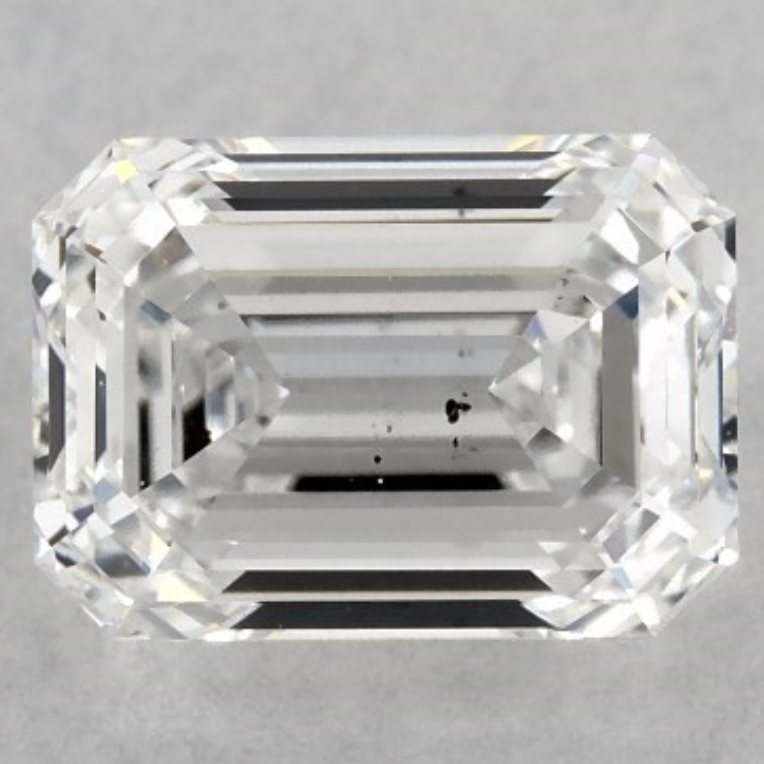 This emerald cut shows exactly why clarity matters more in step cuts Emerald cut SI1 diamond with visible black inclusion under the table, H color, revealing the step cut’s sensitivity to clarity.