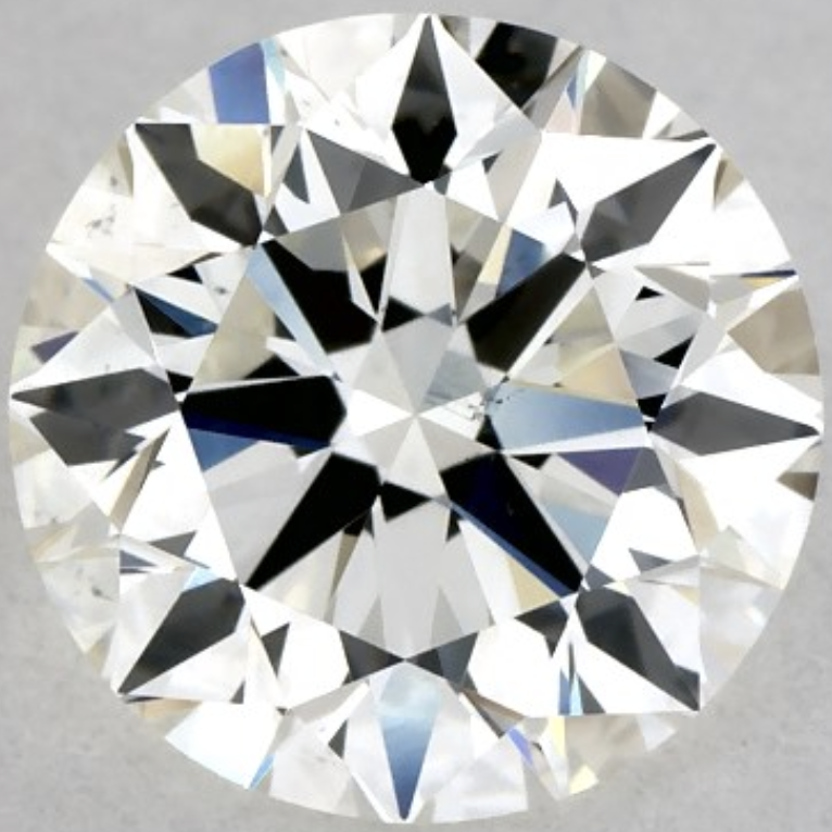 Brighter J Color Diamond with Medium Blue Fluorescence J color round diamond with medium blue fluorescence viewed face-up, showing slightly whiter appearance