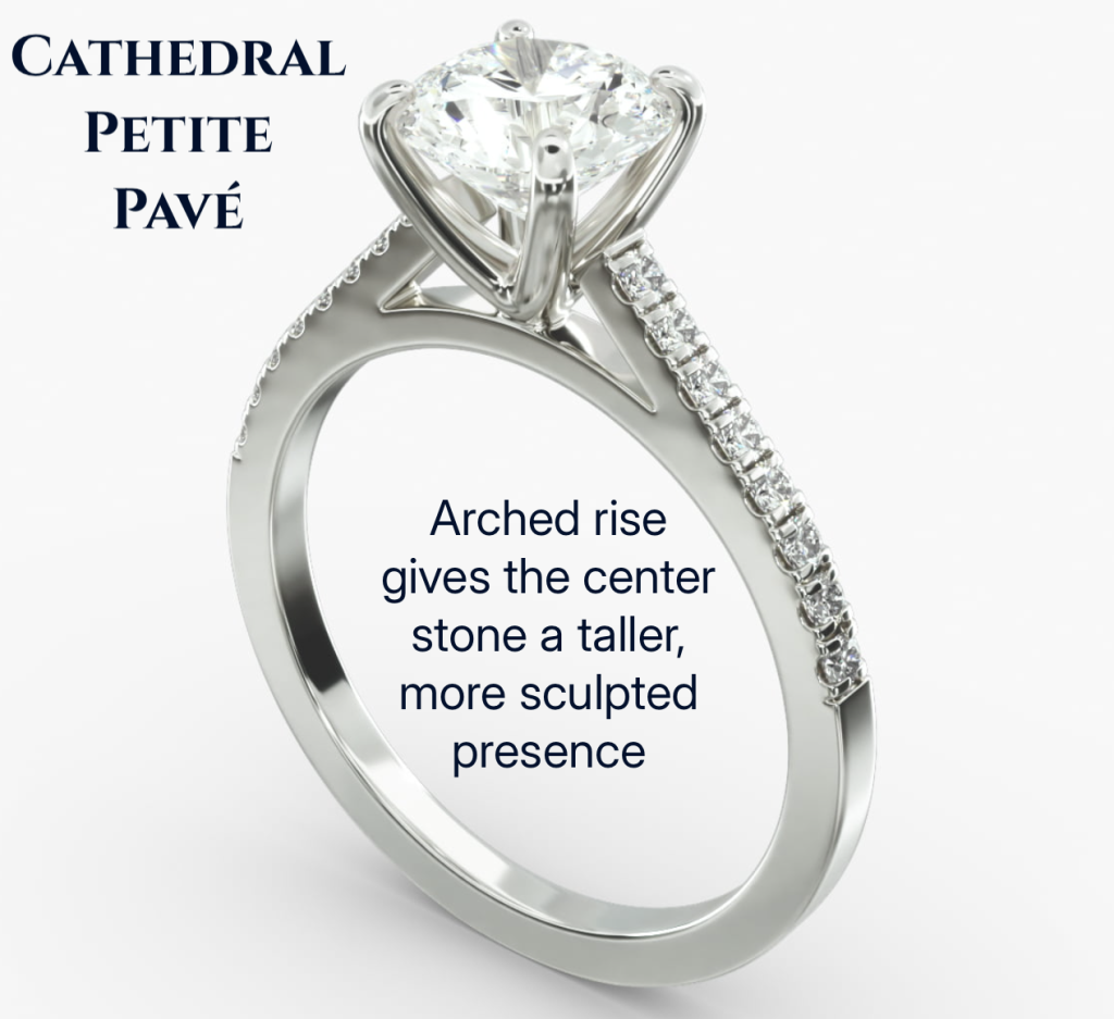 Sculpted Lift and Elegant Profile White gold cathedral petite pavé engagement ring with arched shoulders lifting the center diamond above the band