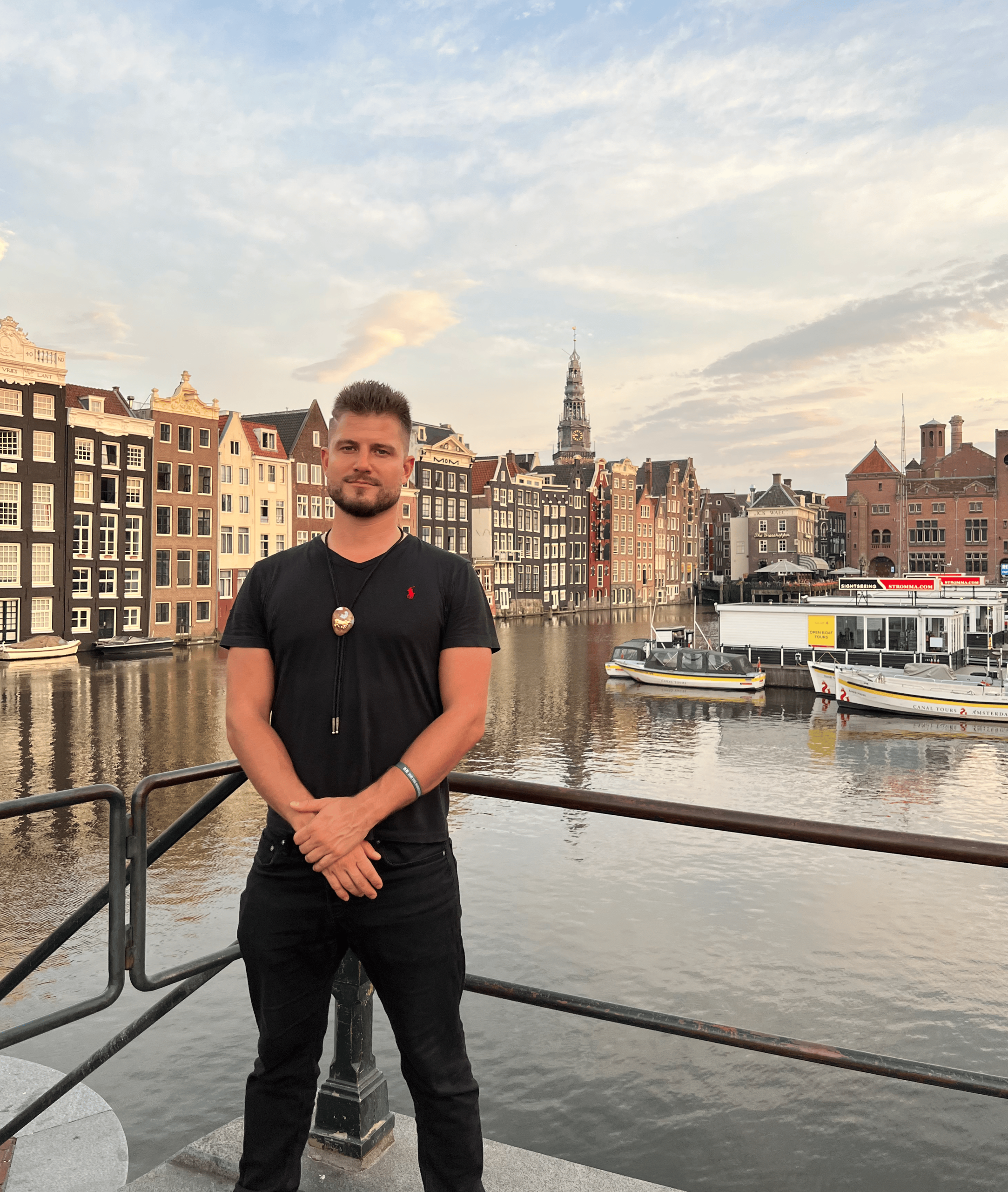 A calm moment in Amsterdam, thinking about diamond clarity and canals Sebastian Naturski sitting by an Amsterdam canal with a thoughtful expression